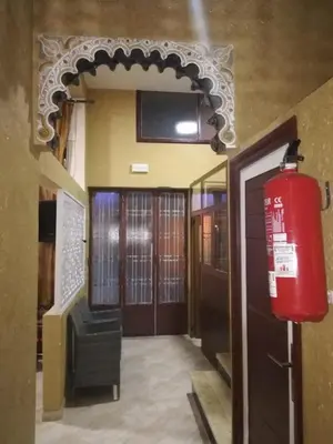 a room with a fire hydrant next to a door at Gite porte oasis in Er Rachidia