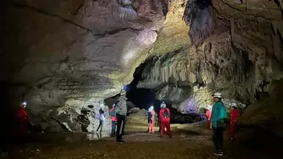 a group of people standing in a cave at Gîte Dayet Chiker in Taza