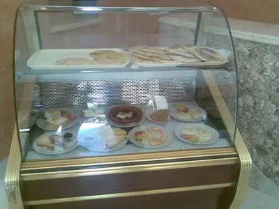a display case filled with different types of food at Hotel Porte Atlas in Imouzzer Kandar