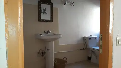 a bathroom with a sink and a toilet at Riad Atlas Berbère in Boumalne