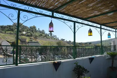 a balcony with a view of a parking lot at Riad Oumkaltoum Fès in Fès