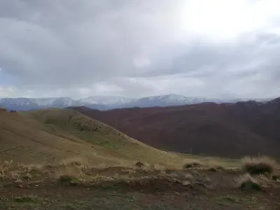 a view of the mountains from the top of a hill at Auberge Restaurant Les Coquelicots in Aït Tamellil