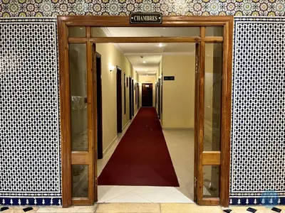 an open door to a hallway in a building at Hôtel Plaisance in Meknès
