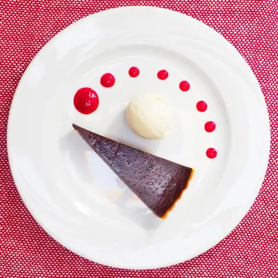 a piece of chocolate cake and ice cream on a plate at Dar Roumana in Fès