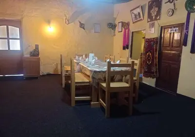 a dining room with a table and some chairs at Auberge Jbel Raids in Tagoudit
