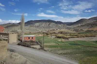 a dirt road in the middle of a mountain at Auberge Jbel Raids in Tagoudit