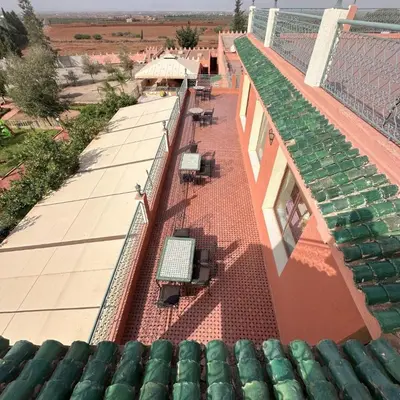 an overhead view of a building with chairs on the roof at Hôtel Relais Saiss in Sefrou