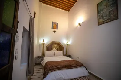 a bedroom with a bed in a room at Dar Mchachti fes in Fès