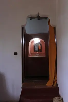 a person walking down a stairs in a bathroom at Chez Yacob kasbah in Agdz