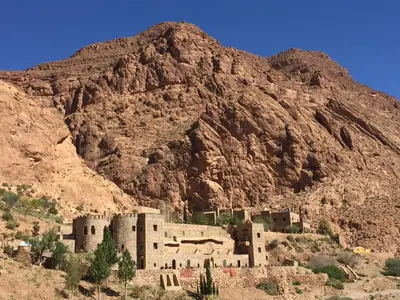a building in front of a mountain at Auberge Le Festival Todra Gorge in Aït Baha