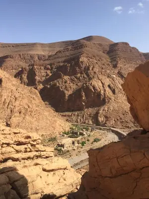 a view of a canyon with a river and mountains at Auberge Le Festival Todra Gorge in Aït Baha