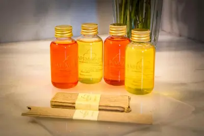 a group of four bottles of honey and a knife at Hapimag Resort Marrakesh in Douar Soukkane