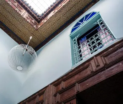 a building with a window and a ball hanging from it at Dar anne in Fès