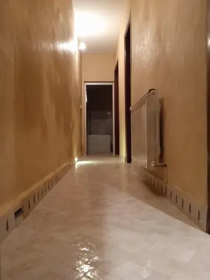 an empty room with a hallway with a hallway at Riad Meyssane Fès in Fès