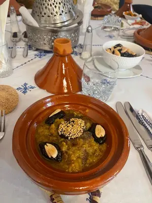 a bowl of food on top of a table at Riad Meyssane Fès in Fès