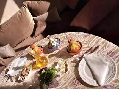 a table with a white table cloth and a white table sidx sidx sidx at Le Chêne d´Azrou in Azrou
