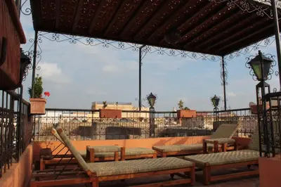 a gazebo with chairs and tables on a patio at Riad Benchekroun in Meknès