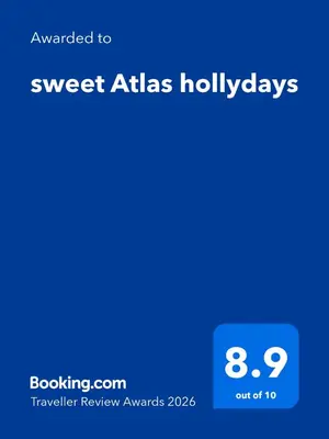 a screenshot of a cell phone with the text upgraded to sweet atlas holidays at sweet Atlas hollydays in Azrou