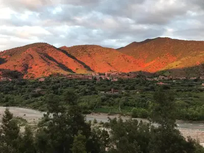 a view of a mountain range with red foliage at Amlougui House in Marrakech