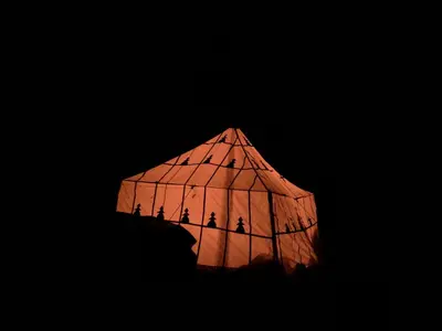 a group of people in a cage at night at Amlougui House in Marrakech