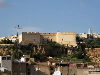 a large building on top of a hill with buildings at Dar Eva in Fès