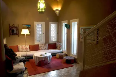 a living room with a couch and a table at Villa Zagora Ma Villa au Sahara in Zagora