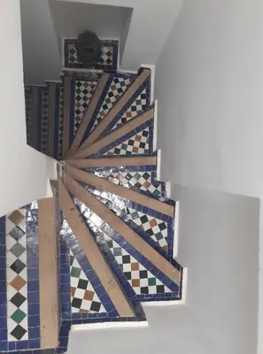 a view from the ceiling of a room with colorful tiles at Riad Fés blida in Fès