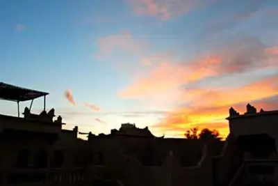 a sunset with the sky in the background at Kasbah Dar Dmana in Skoura