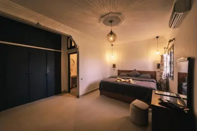 a bedroom with a bed in a room at The Kozyhome in Ouarzazate