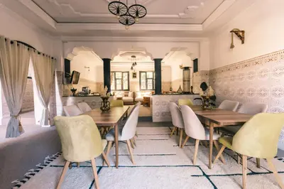 a dining room with a table and chairs at The Kozyhome in Ouarzazate