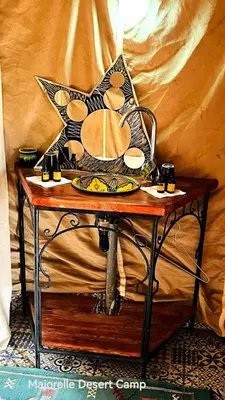 a table with a plate on top of it at Majorelle Desert Camp in Zagora