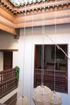 three baskets hanging from a ceiling in a room at Riad Dar Rafti - Restaurant & Rooms with en-suite in Fès