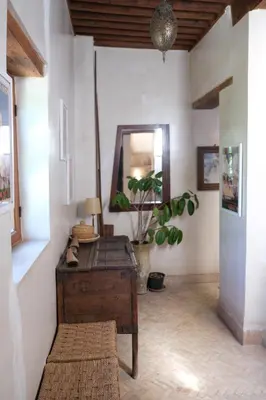 a room with a desk and a potted plant at Riad Dar Rafti - Restaurant & Rooms with en-suite in Fès