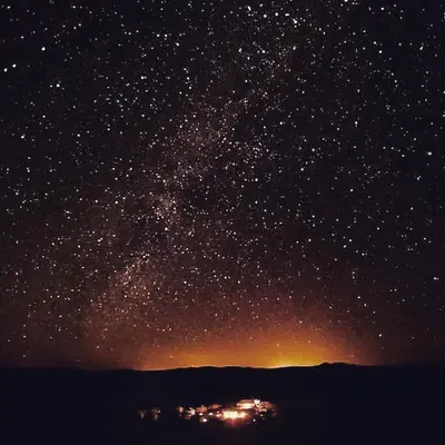 a star filled night sky with a lot of stars at sand rose luxury camp in Merzouga
