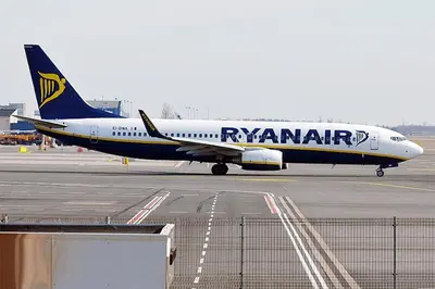 a ryanair airplane sitting on the runway at an airport at LOGEMENT HOTEL et NAVETTE GRATUITE in Fès