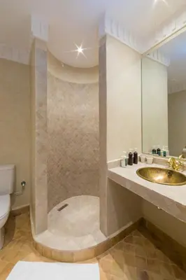 a bathroom with a sink and a toilet at Chez Ichou in Aït Idaïr