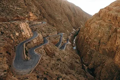 a winding road on the side of a mountain at Chez Ichou in Aït Idaïr