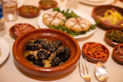 a table with a bowl of food on a table at Riad Arabella in Fès