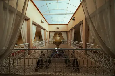 a hallway of a building with a glass ceiling at Riad Chebbi in Merzouga