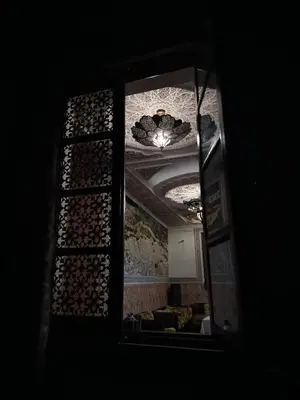 a view of a room with a ceiling and a mirror at PALAIS LARAICHI Riad la porte bleue suites in Fès