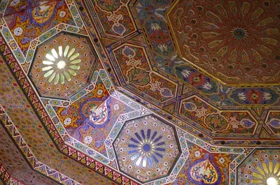 a ceiling of a building with colorful painted ceilings at La Citadelle Marrakech in Marrakech
