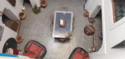 an overhead view of a room with a table and chairs at Riad Dar Mystère in Fès
