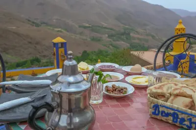 a table with plates of food on top of a table at Dar Bejmate - Chez Hassan in Tacheddirt