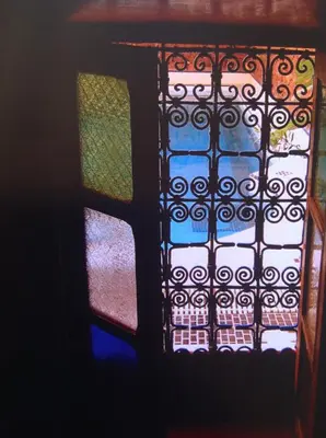 a stained glass window in a room at Riad Timadrouine, hôtel et restaurant in Tinerhir