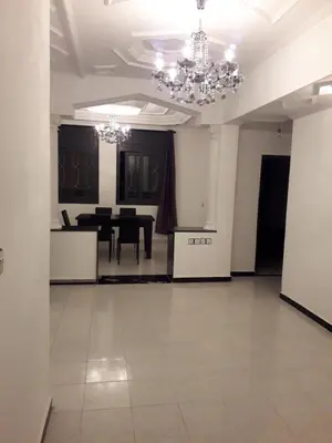 a large room with a dining room and a table at Appartement Moderne 3 Chambres in Fès