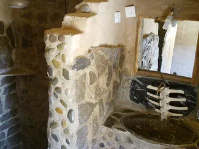 a bathroom with a sink and a mirror at Maison Boutchrafine in Erfoud