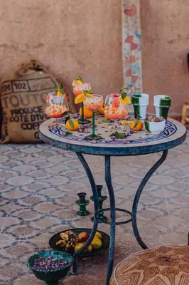 a table with food on top of it with pumpkins on it at Hotel Carrefour des Nomades in Mhamid