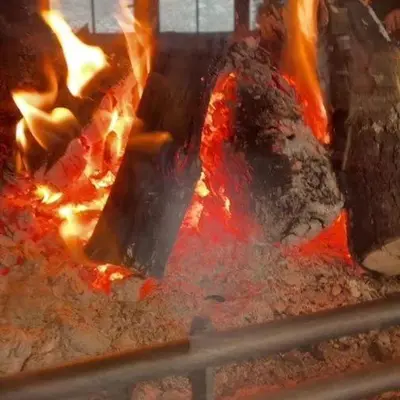 a grill with a bunch of fire in it at Atlas Crown - Chalet de luxe in Ifrane