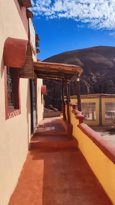 a porch of a building with a view of a mountain at maison isabel in Boumalne