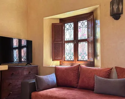 a living room with a couch and a window at Villa Sophia in Azib Oulad Lâdem